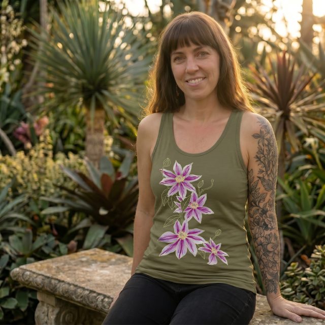 Clematis — n.
A climber in search of possibility.
Moves through structure without belonging to it.
Flowers wherever light finds an opening.

#MarigoldConspiracy #Clematis #BotanicalWear #WearableArt #ArtYouCanWear #NatureInspiredDesign #HumanArtRespondingToNature #DaffodilFlower #clematisviticella #CoastalStyle #BeachAesthetic #CaliforniaStyle #WestCoastVibes #GraphicTank #WomensStyle #IndieBrand #SmallBrandLove #ArtistMade #IllustrationOnClothing #BotanicalIllustration